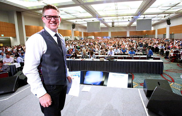 Ferry on stage at his biggest annual event with several thousand people.